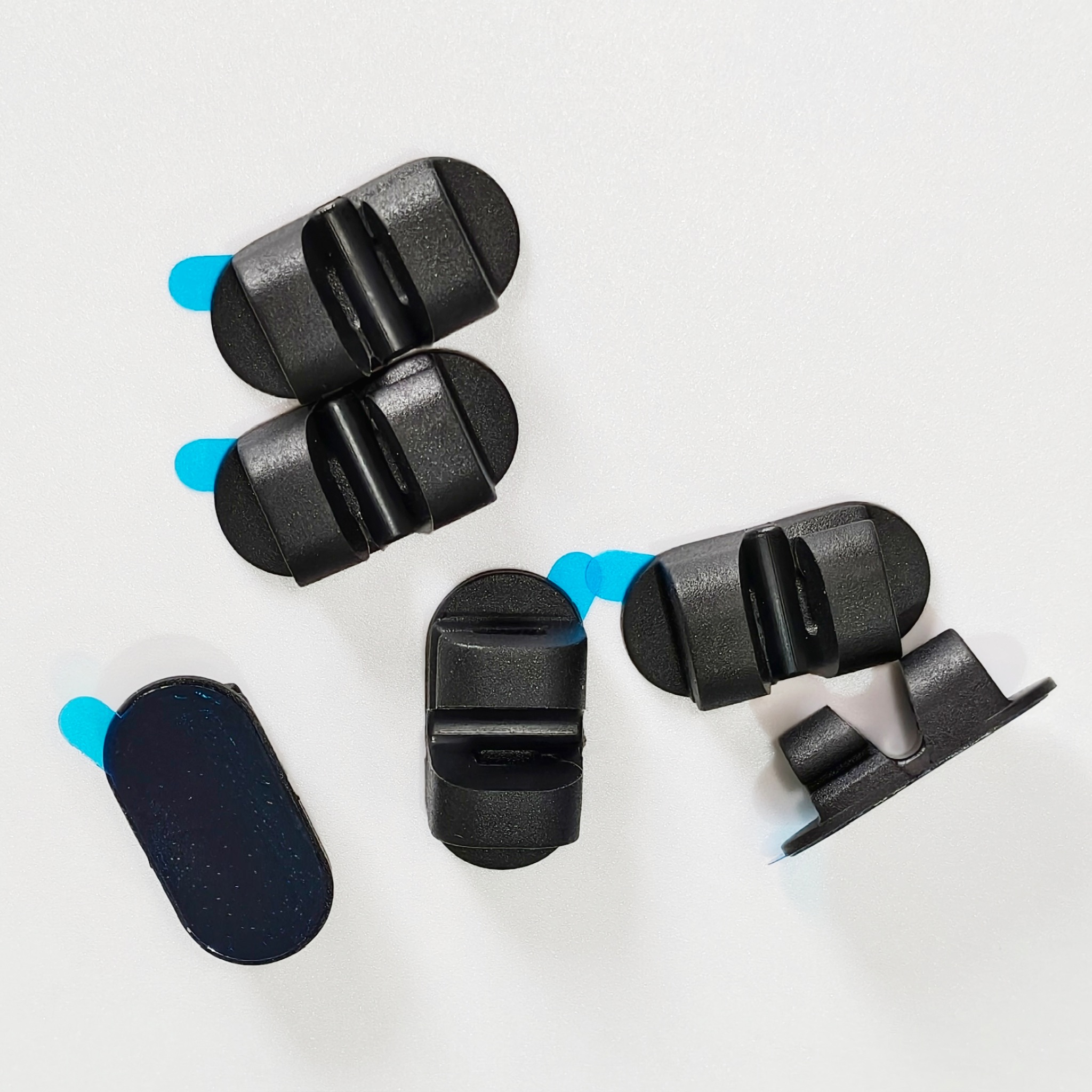 Dual-Slot Oval Silicone Cord Organizer with Adhesive Backing