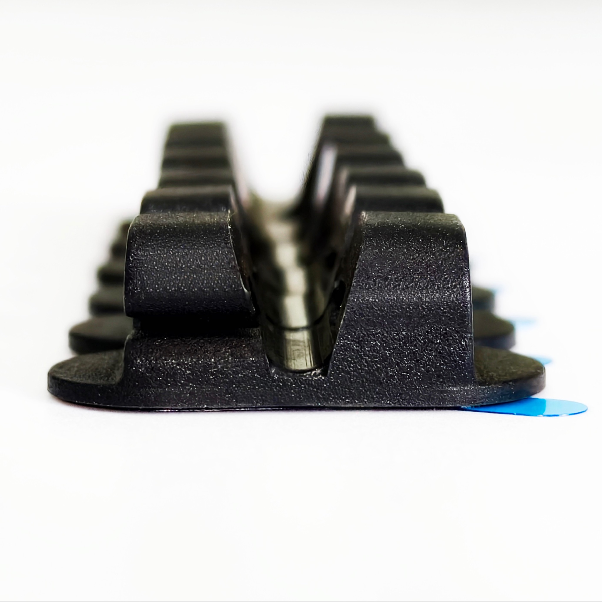 Dual-Slot Oval Silicone Cord Organizer with Adhesive Backing